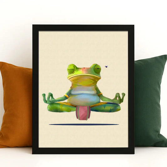 Close-up of framed Meditating Frog Wall Art print against white wall with mustard and green cushions — quirky handmade frog illustration.