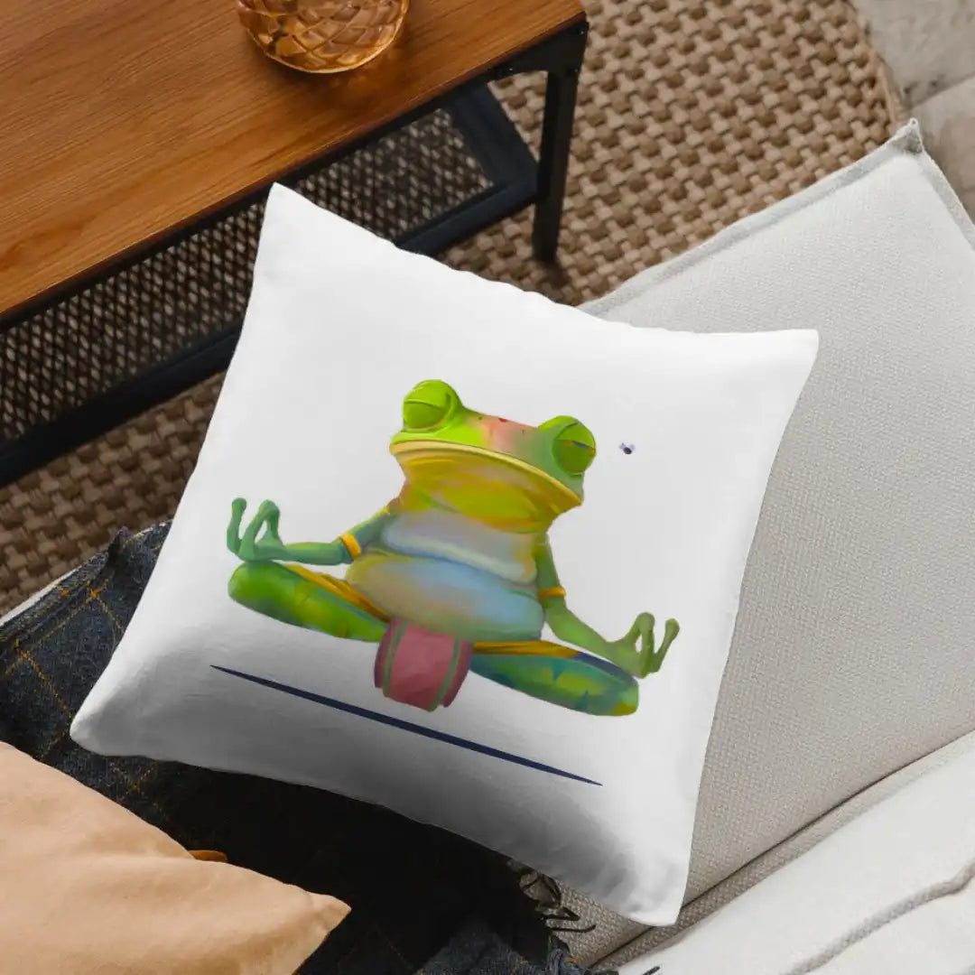 Meditating frog cushion placed on a cream sofa with soft lighting and a wooden coffee table, creating a peaceful lounge setting.