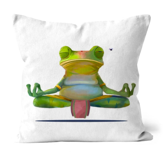 Meditating frog cushion with vibrant green and blue tones, printed on white faux suede, displayed against a plain background.